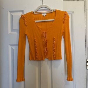 Find Me Now orange ruffle tie-up knit top